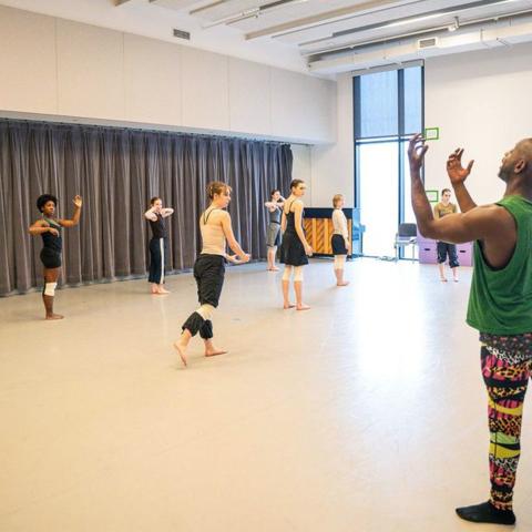 Kurt Douglas (right) leads student dancers in a rehearsal for José Limón’s The Unsung.